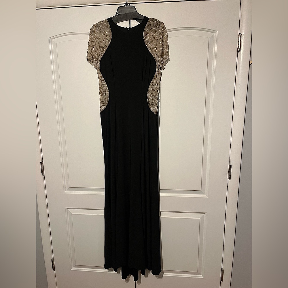 NTN…..Xscape Caviar beaded mesh short sleeves crew neck Jersey sheath gown.